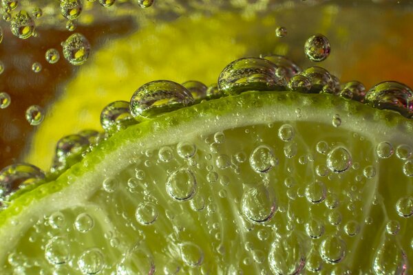 Lime under water with bubbles