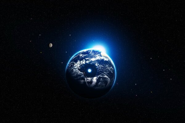 Планета со светящейся дыркой посередине на черном небе