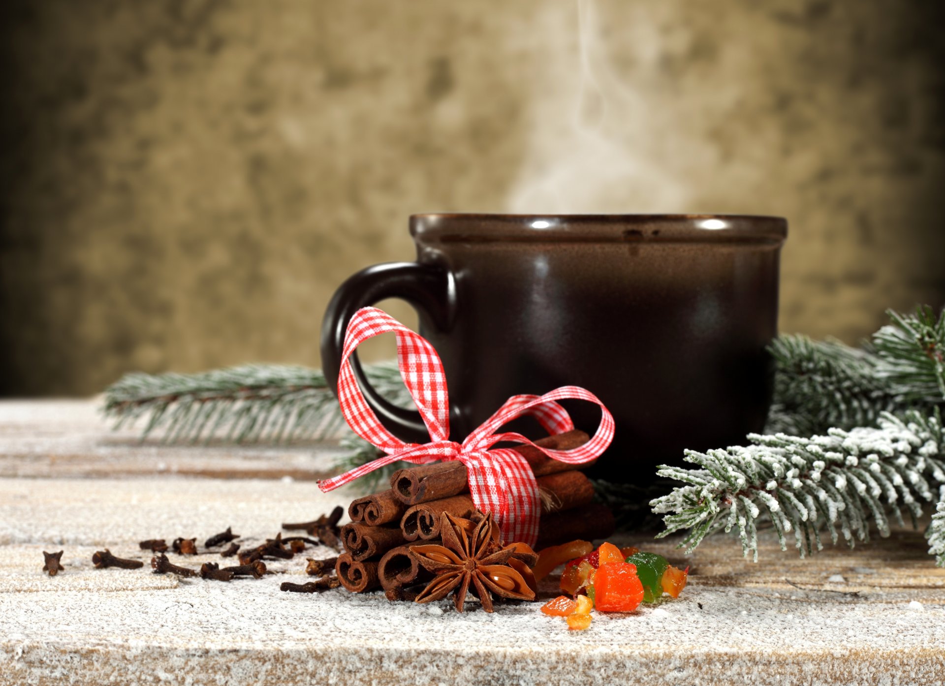 cup cinnamon sticks anise star anise spices winter snow branch spruce holiday