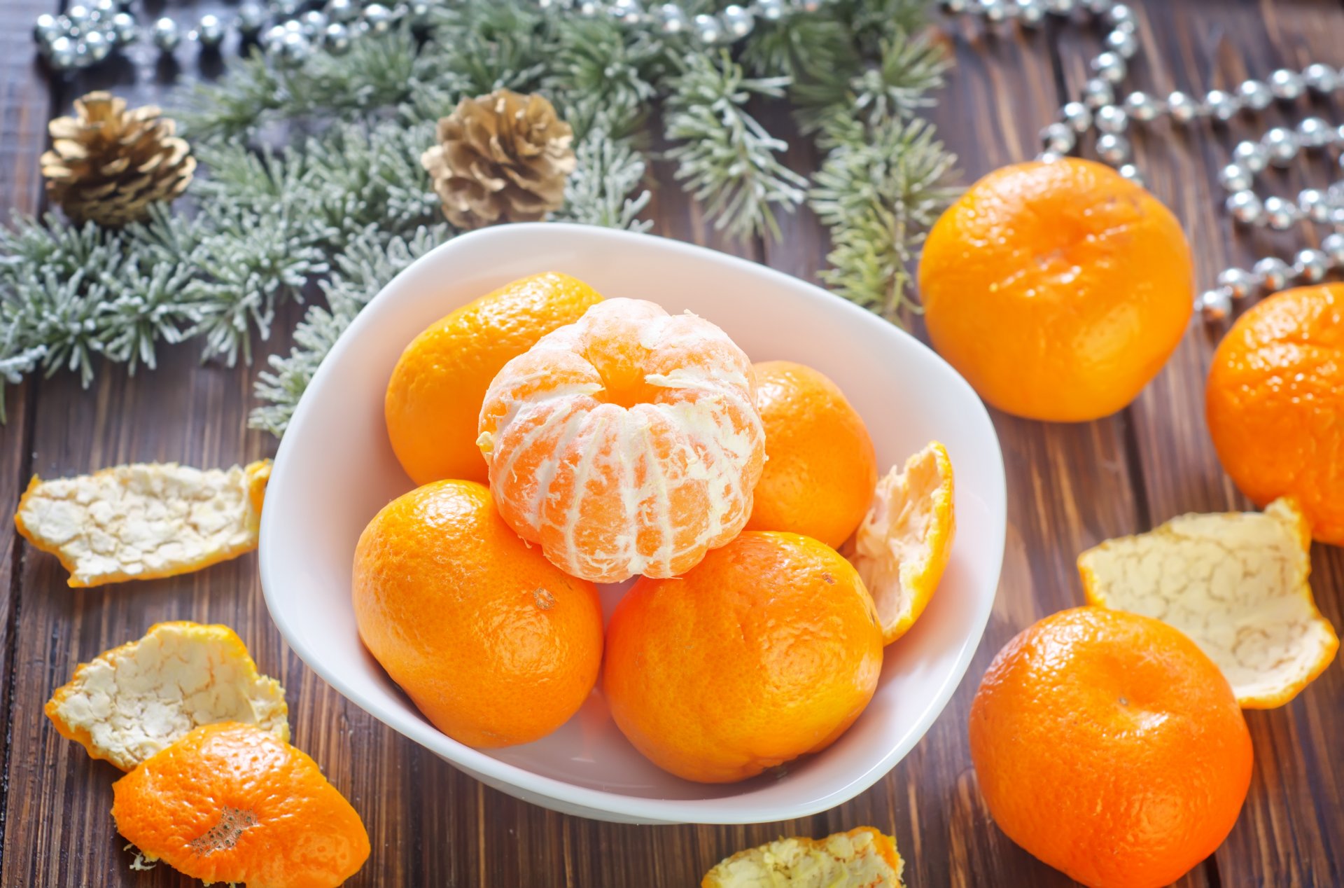 mandarins citrus fruits orange peel dish branches spruce beads holidays winter