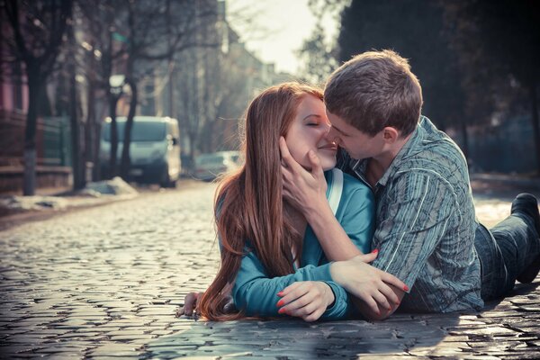 A couple in love passionately kiss on a gift