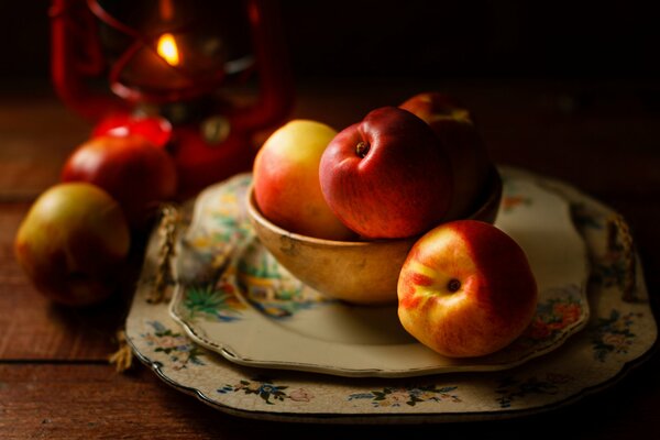 Nectarines on beautiful plates on the table