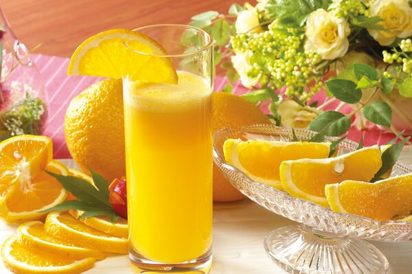 Orange drink photo. Yellow fruit slicing in the photo