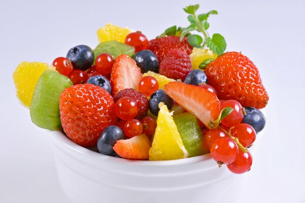 Variety of berries. Juicy strawberries and kiwi. Sweet blueberries and raspberries