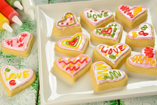 Beautiful cookies in the form of hearts. Sweet joy