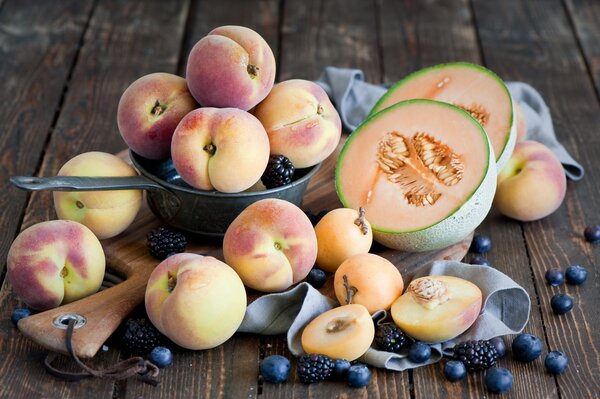 Still life of fresh fruit on a wooden background