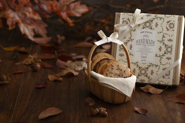 Autumn still life with leaves, a basket of cookies with chocolate chips