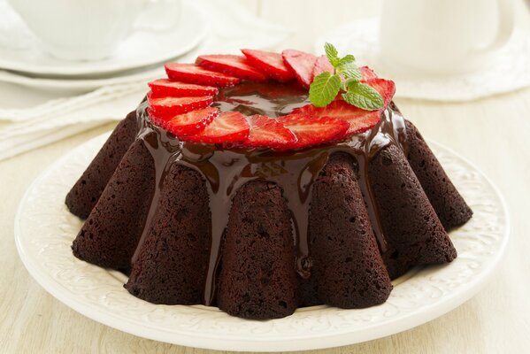 Chocolate dessert with strawberries and mint