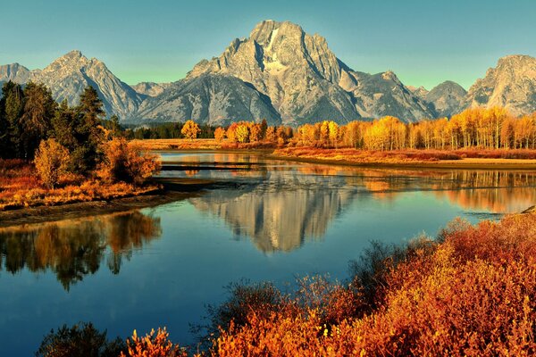 Autumn landscape with river and mountains