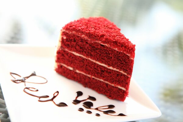 Sweet red dessert on a plate with the inscription