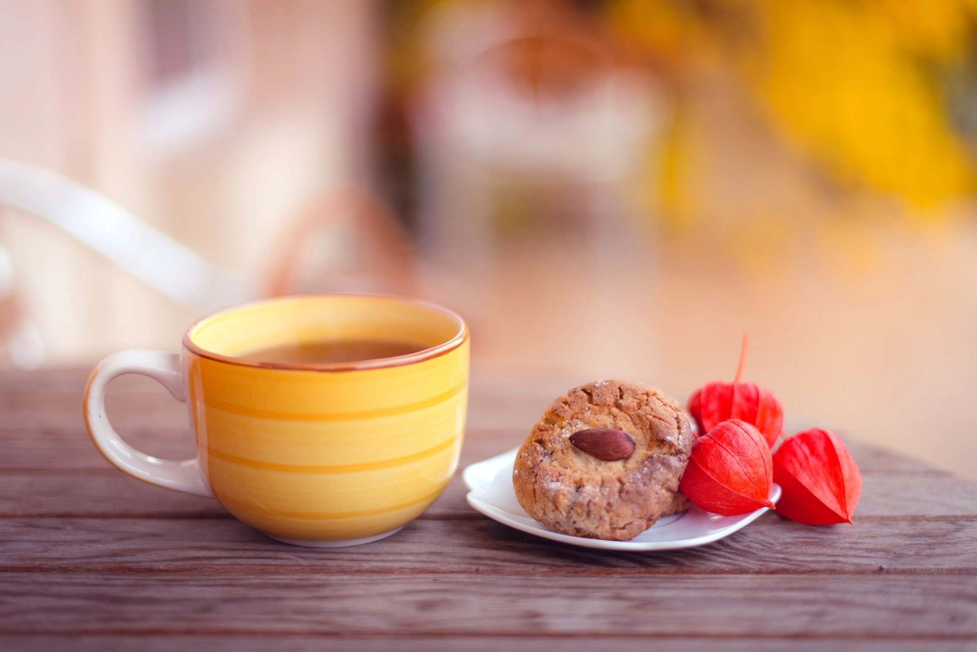 cup yellow tea cookies almonds baking table autumn