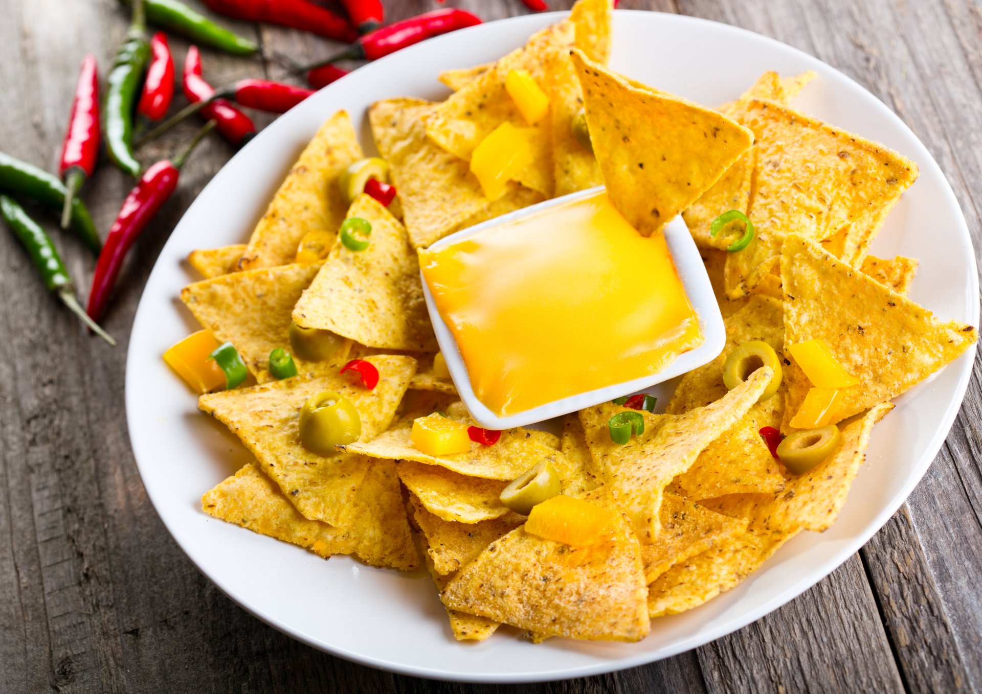 food mexican nachos chips snack cheese spices olives dish