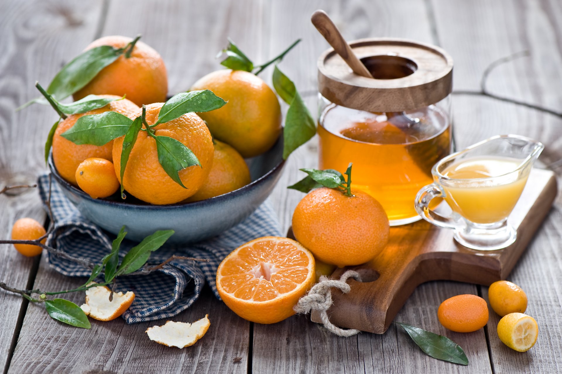 mandarins kumquat citrus fruits orange honey juice peel leaves tableware still life winter anna verdina