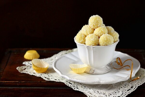 Dessert coconut balls in a white cup