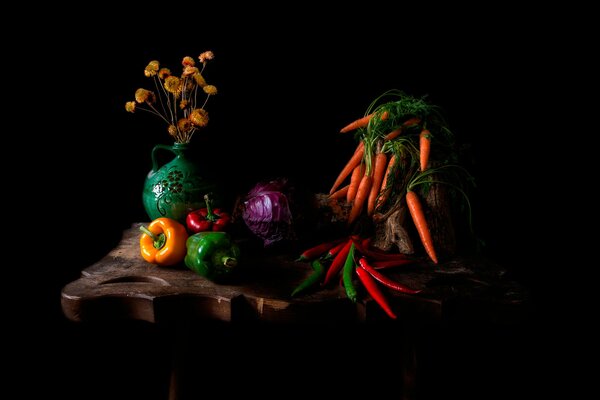 Still life with vegetables and flowers in a vase