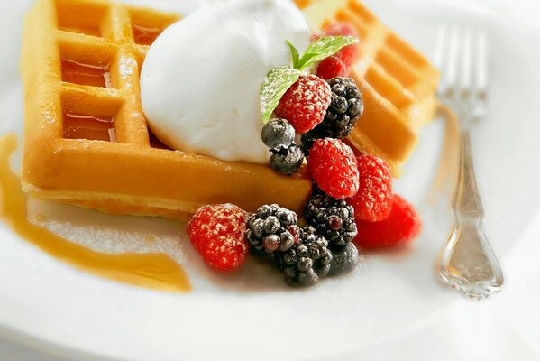 Lush waffles with berries and ice cream