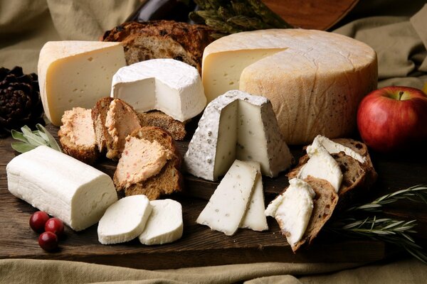 Still life of cheeses and rosemary