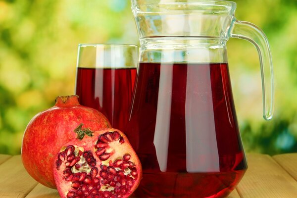 Bright red pomegranate juice on the table