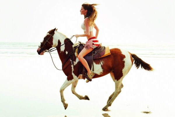 A model on a horse gallops