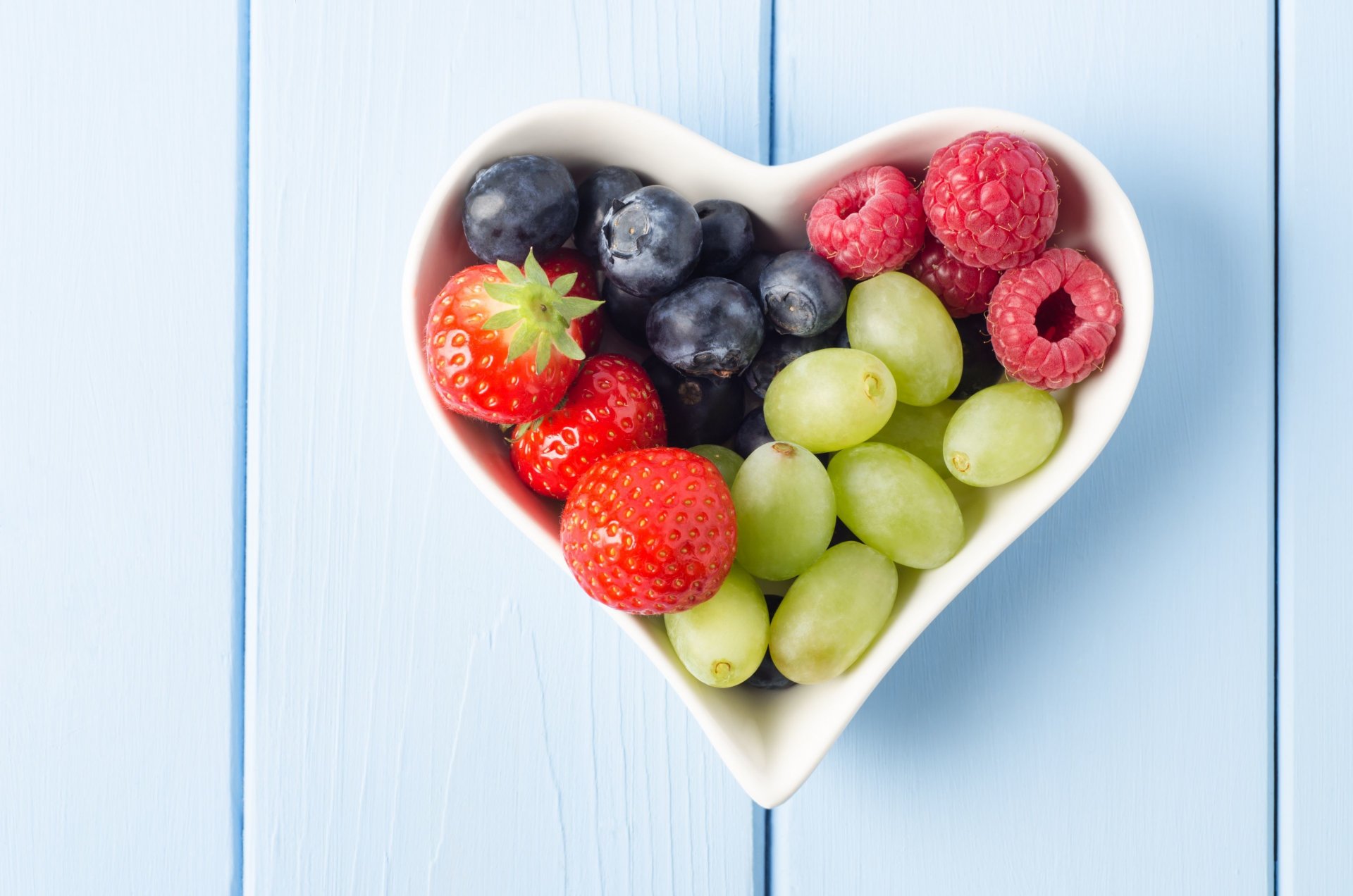 food berries blueberries strawberries grapes raspberries plate shape heart heart background wallpaper widescreen fullscreen widescreen widescreen