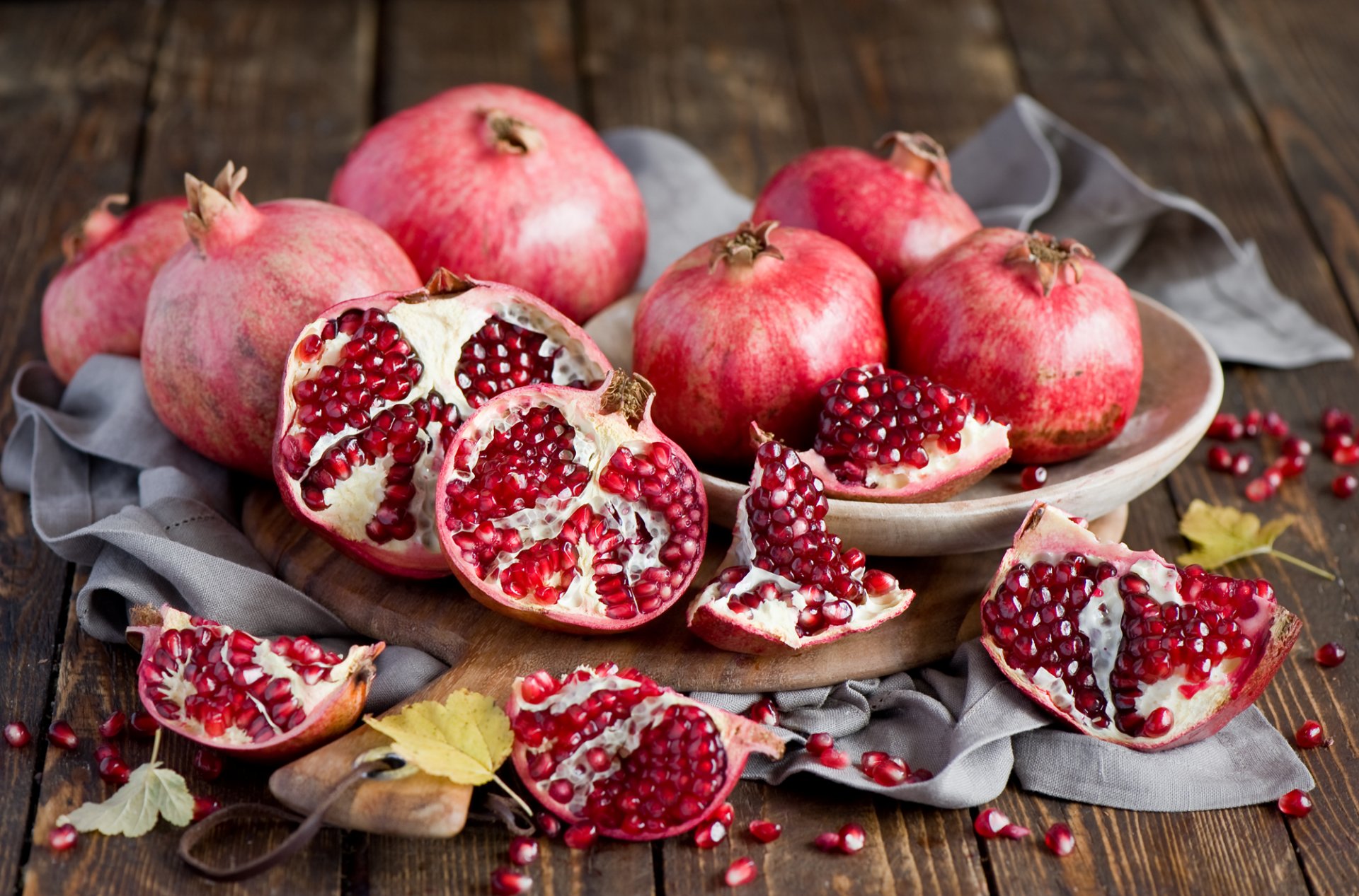 grenade grain fruits red dish board leaves yellow autumn still life anna verdina