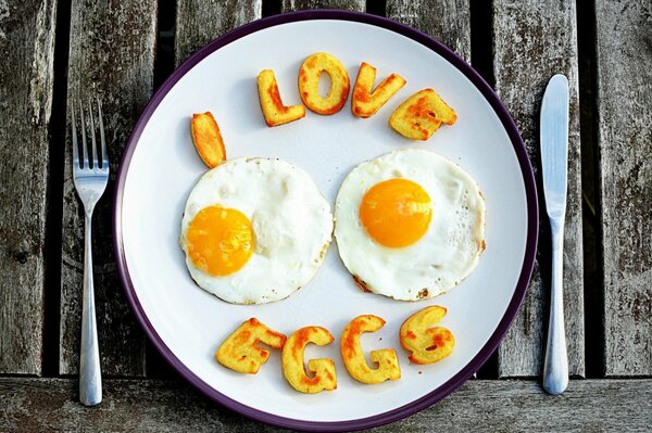 Cheerful scrambled eggs from two eggs for breakfast