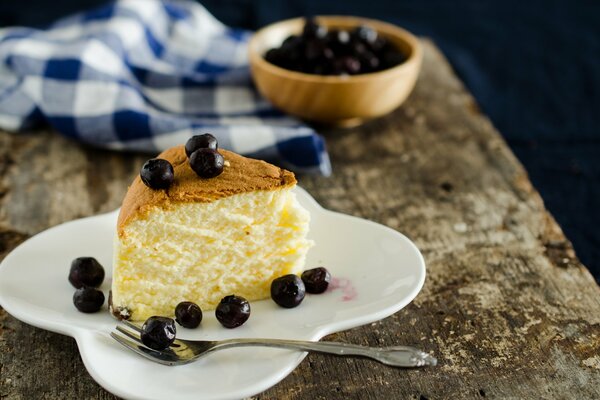 A piece of cake with black currants