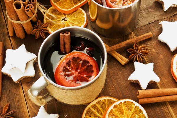 Mug of mulled wine with cinnamon sticks