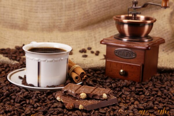 Chocolate bar on the background of a cup of coffee