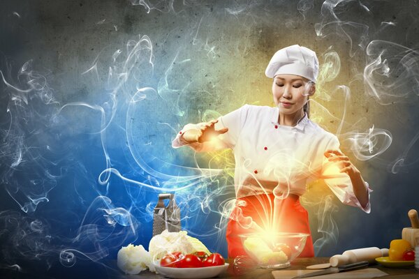 Азиатка повар колдующая над блюдом