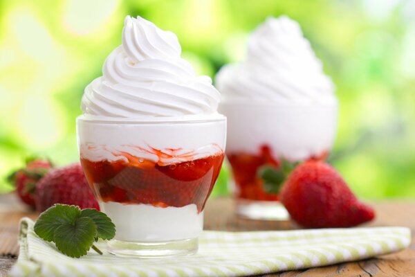 Strawberry ice cream dessert with cream and mint