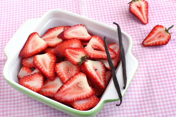 Dish with sliced red strawberries