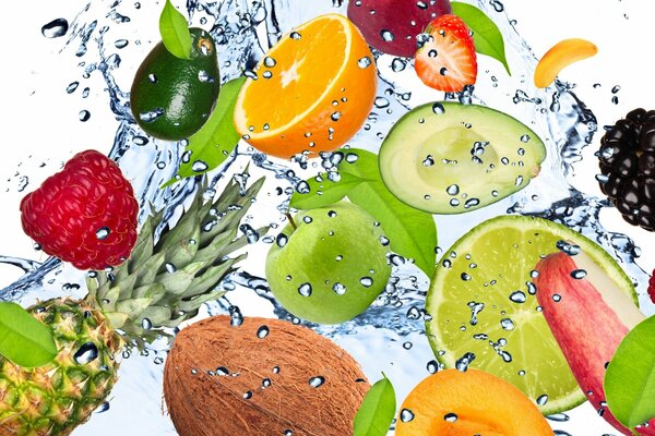 Different fruits and berries under running water