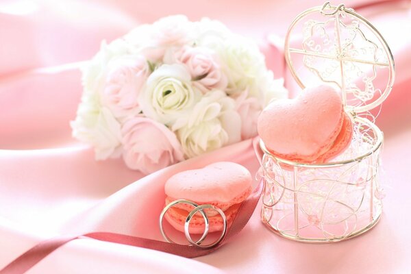Une boîte avec des fleurs et des biscuits de roses et un anneau pour votre bien-aimé