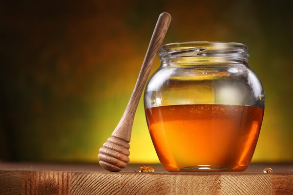 A jar of honey standing on the table