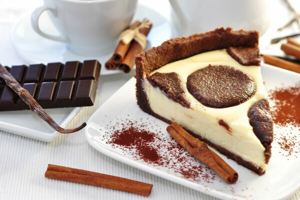 Dessert with cinnamon sticks and a chocolate bar