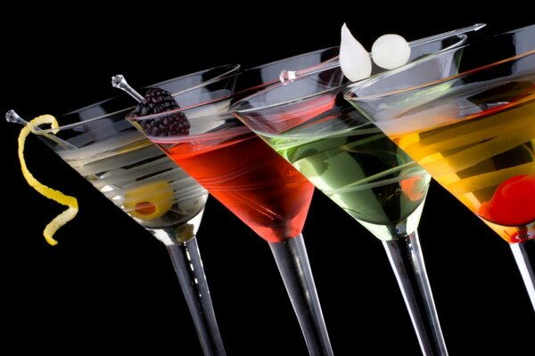 Multi-colored cocktails in high-stemmed glasses