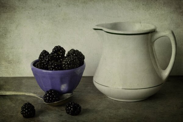 Blackberries in a bowl and a white jug