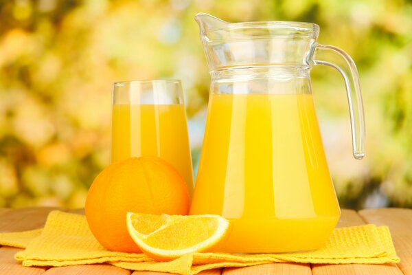 A jug of orange juice on the table