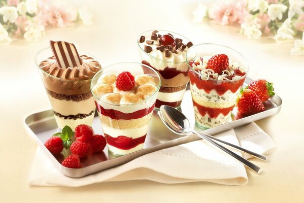 Chocolate and berry trifles on a silver tray