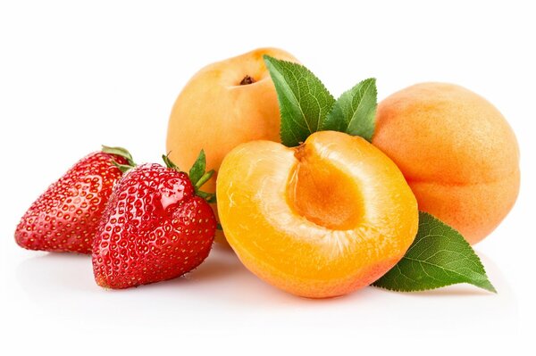 Apricots and strawberries with green leaves