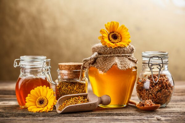 A jar with honey and sunflower on it