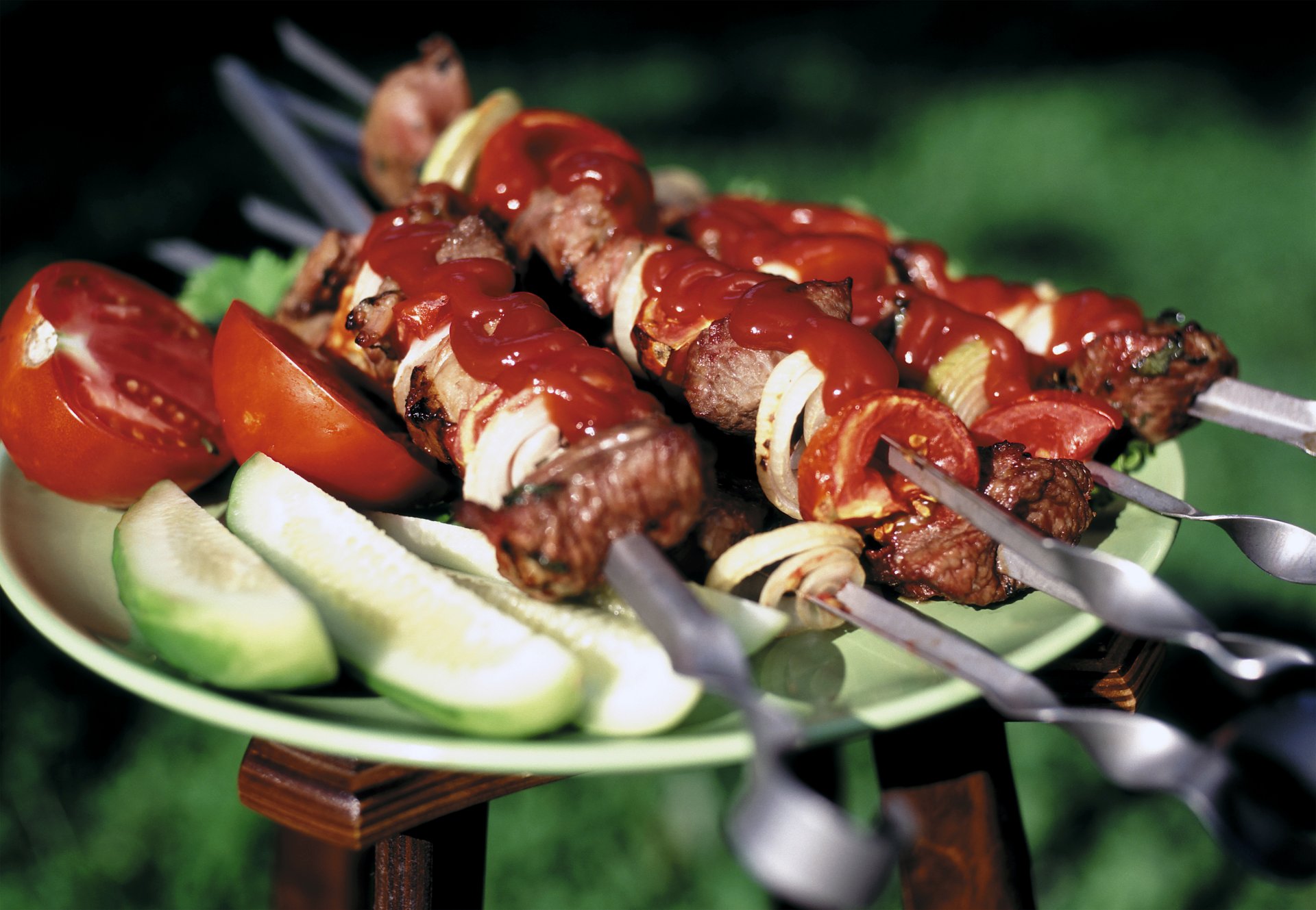 food barbecue meat ketchup vegetables cucumbers tomatoes skewer