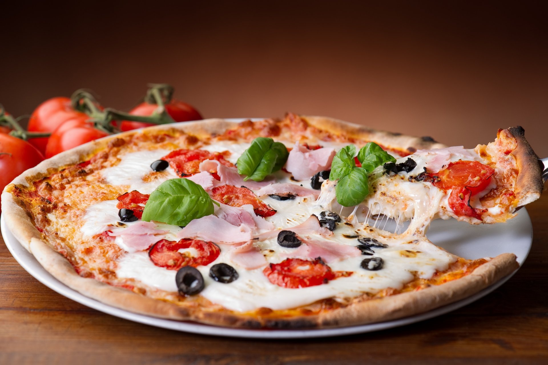 pizza dish olives cheese tomatoe