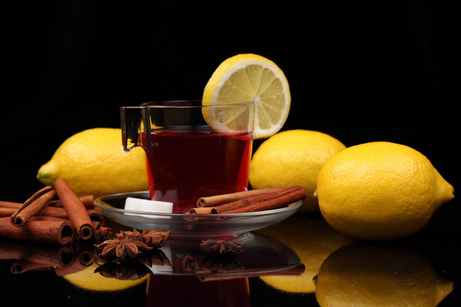 mug saucer tea sugar drink cinnamon star anise lemons table reflection