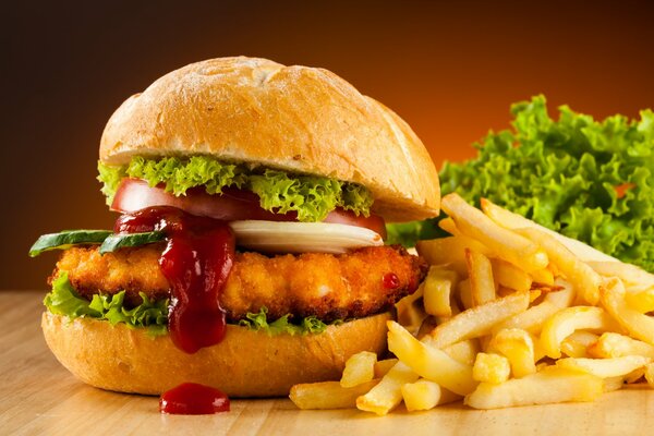 Burger with juicy cutlet, fresh vegetables, delicious sauce plus a lettuce leaf. French fries