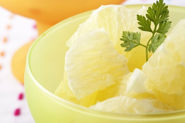 Pineapple with parsley in a bowl