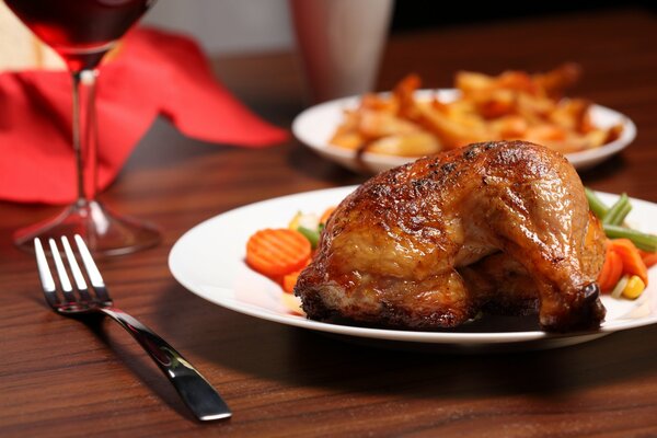 Plate with fried chicken and vegetables