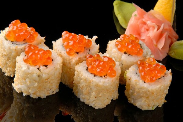 Rolls with red caviar and ginger