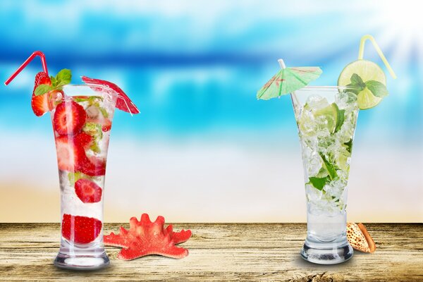 Mojito with lime and strawberries quenches thirst by the sea